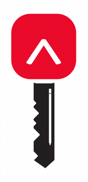 L'image d'une clé noire avec le contour d'un crayon blanc dans la tige. La tête de la clé est le logo « caret » de Réviseurs Canada dans un carré arrondi.
